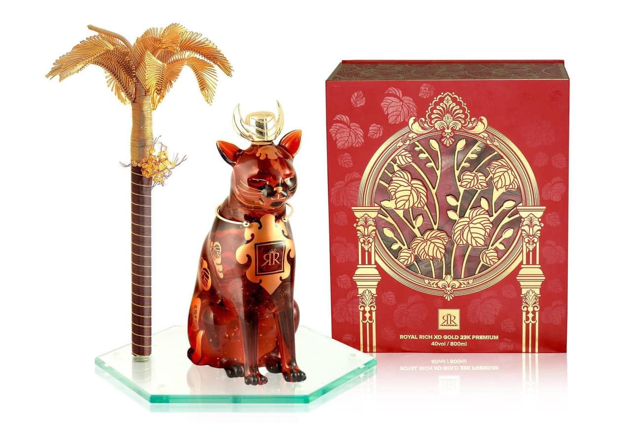 RƯỢU MÈO ĐÔNG HỒ ngồi dưới cây cau vàng - Royal Rich XO Gold 23K PREMIUM tân bình